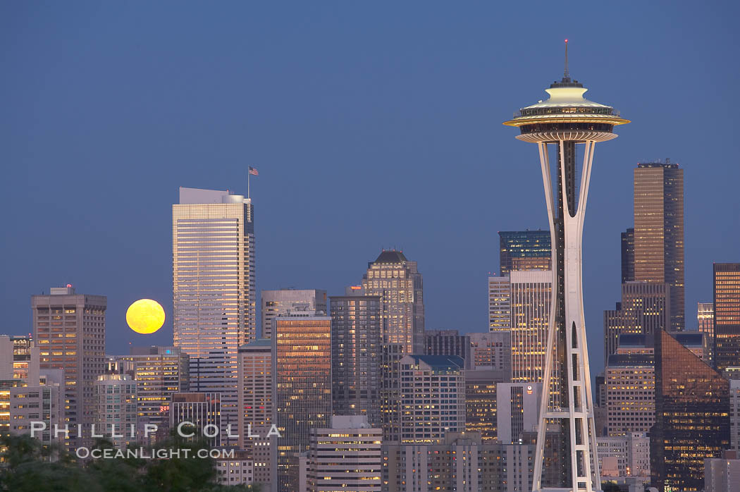 Full moon rises over Seattle city skyline at dusk, Space Needle at right. Washington, USA, natural history stock photograph, photo id 13660