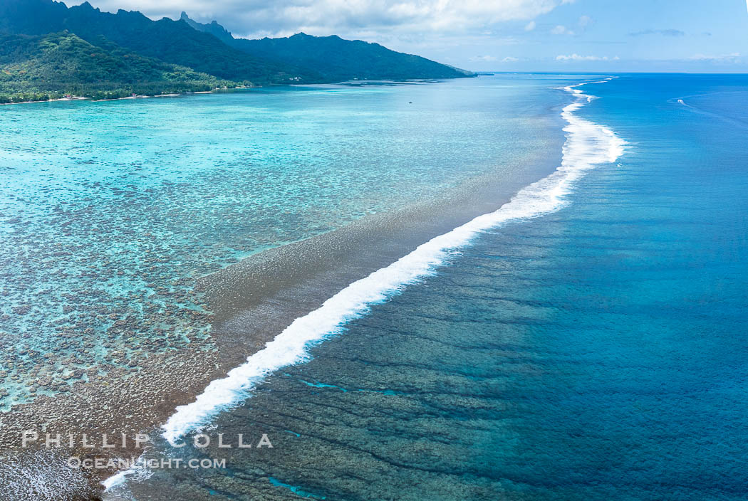 Waves break on Moorea's Barrier Reef, with shallow reef flat and protected lagoon to the left and open ocean to the right. French Polynesia, France, natural history stock photograph, photo id 40667